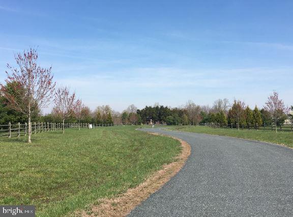 28966 Jennings Road Easton, MD 21601 - Photo 2 of 8 a view of a golf course with a lake