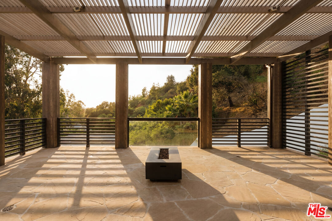 1105 Rivas Canyon Road Pacific Palisades, CA 90272 - Photo 31 of 49 a balcony with furniture
