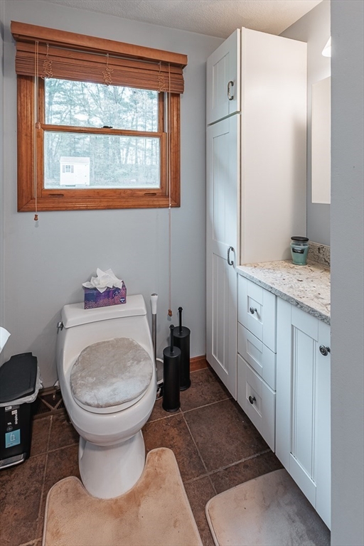 26 Hunter Avenue Hudson, MA 01749 - Photo 15 of 42 a bathroom with a sink toilet and a mirror