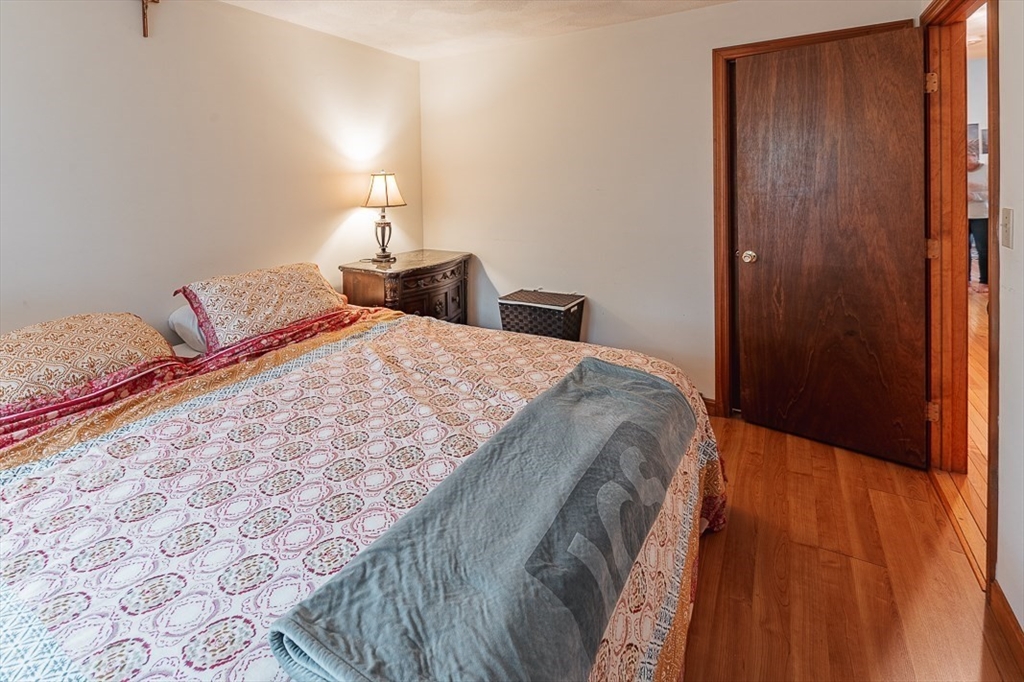 26 Hunter Avenue Hudson, MA 01749 - Photo 19 of 42 a bedroom with a bed and a lamp