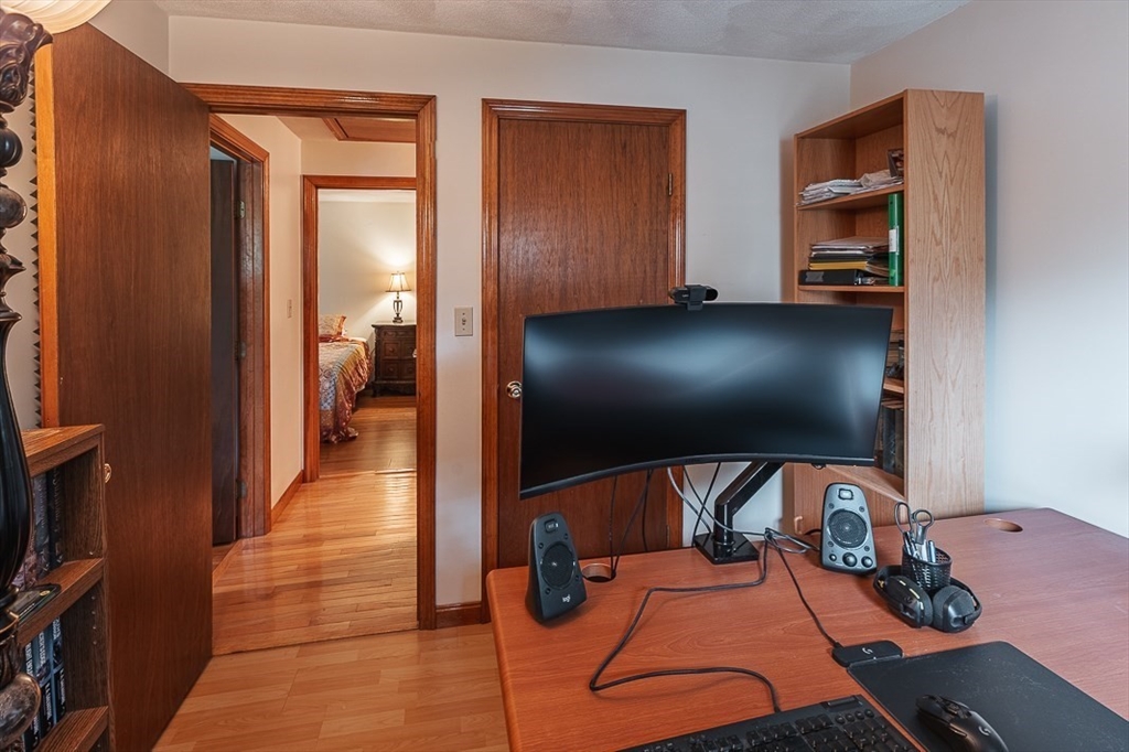 26 Hunter Avenue Hudson, MA 01749 - Photo 21 of 42 a room with gym equipment and a flat screen tv