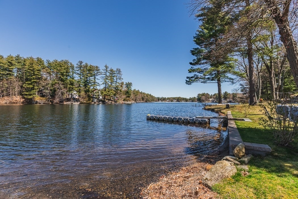 26 Hunter Avenue Hudson, MA 01749 - Photo 3 of 42 a view of a lake with boats and trees in the background