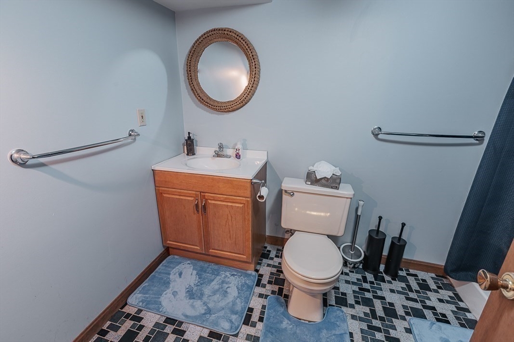 26 Hunter Avenue Hudson, MA 01749 - Photo 32 of 42 a bathroom with a toilet a sink and a mirror