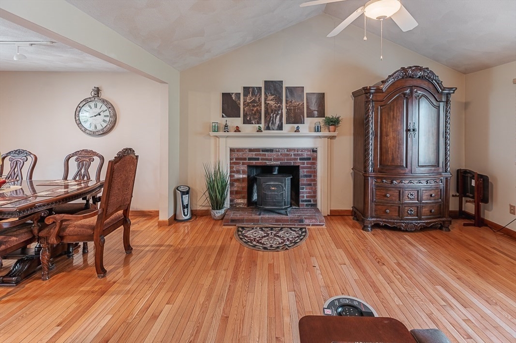 26 Hunter Avenue Hudson, MA 01749 - Photo 8 of 42 a living room with furniture and a fireplace