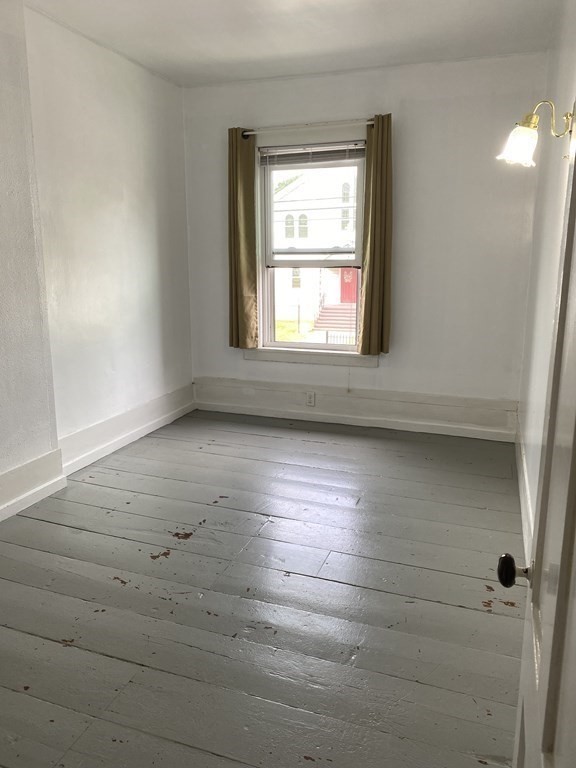 2271 Main Street Warren, MA 01092 - Photo 12 of 26 an empty room with wooden floor and windows