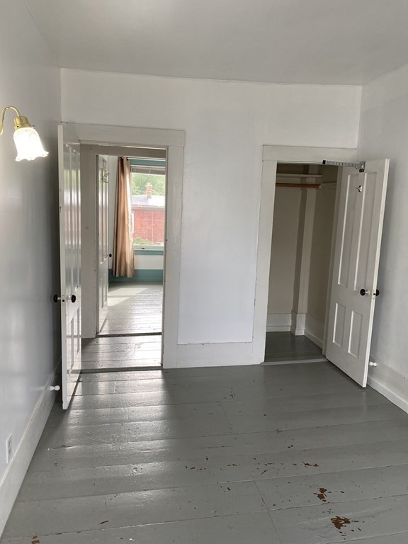 2271 Main Street Warren, MA 01092 - Photo 13 of 26 a view of a hallway with wooden floor and a living room