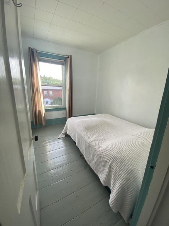 2271 Main Street Warren, MA 01092 - Photo 17 of 26 a bedroom with a bed and a window