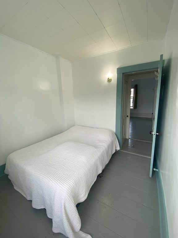 2271 Main Street Warren, MA 01092 - Photo 18 of 26 a large bed sitting in a bedroom next to a window