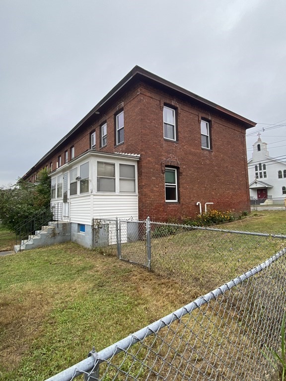 2271 Main Street Warren, MA 01092 - Photo 3 of 26 a front view of a house with a yard