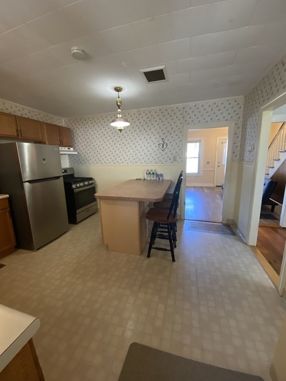 2271 Main Street Warren, MA 01092 - Photo 4 of 26 a workspace with furniture and a kitchen