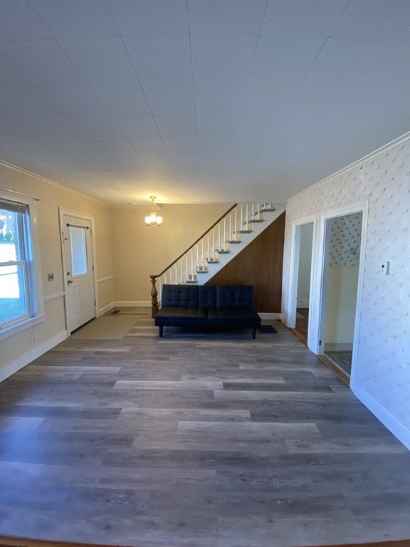 2271 Main Street Warren, MA 01092 - Photo 7 of 26 a view of an empty room with wooden floor and stairs