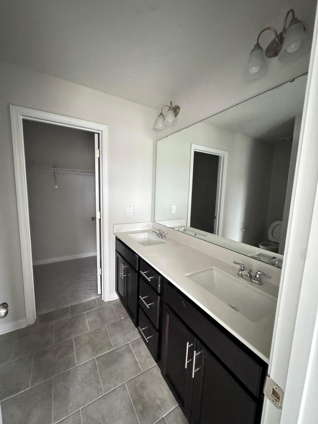 1038 Bristol Arch Drive Graham, NC 27253 - Photo 11 of 21 a bathroom with a sink a vanity and a mirror