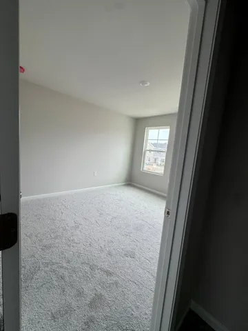 a view of a hallway with stairs