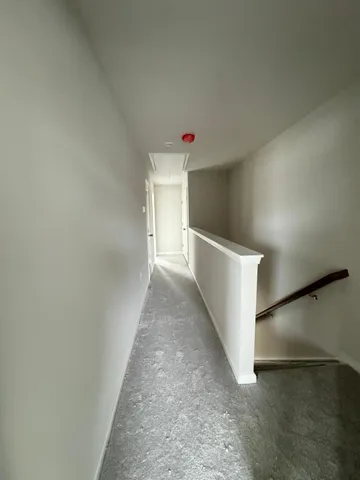 a white toilet sitting next to a bathroom sink