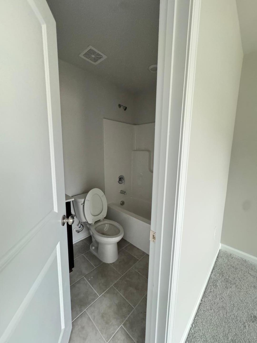 1038 Bristol Arch Drive Graham, NC 27253 - Photo 16 of 21 a white toilet sitting next to a bathroom sink