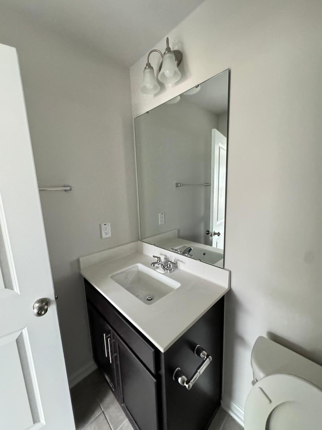 1038 Bristol Arch Drive Graham, NC 27253 - Photo 19 of 21 a bathroom with a sink vanity and a mirror