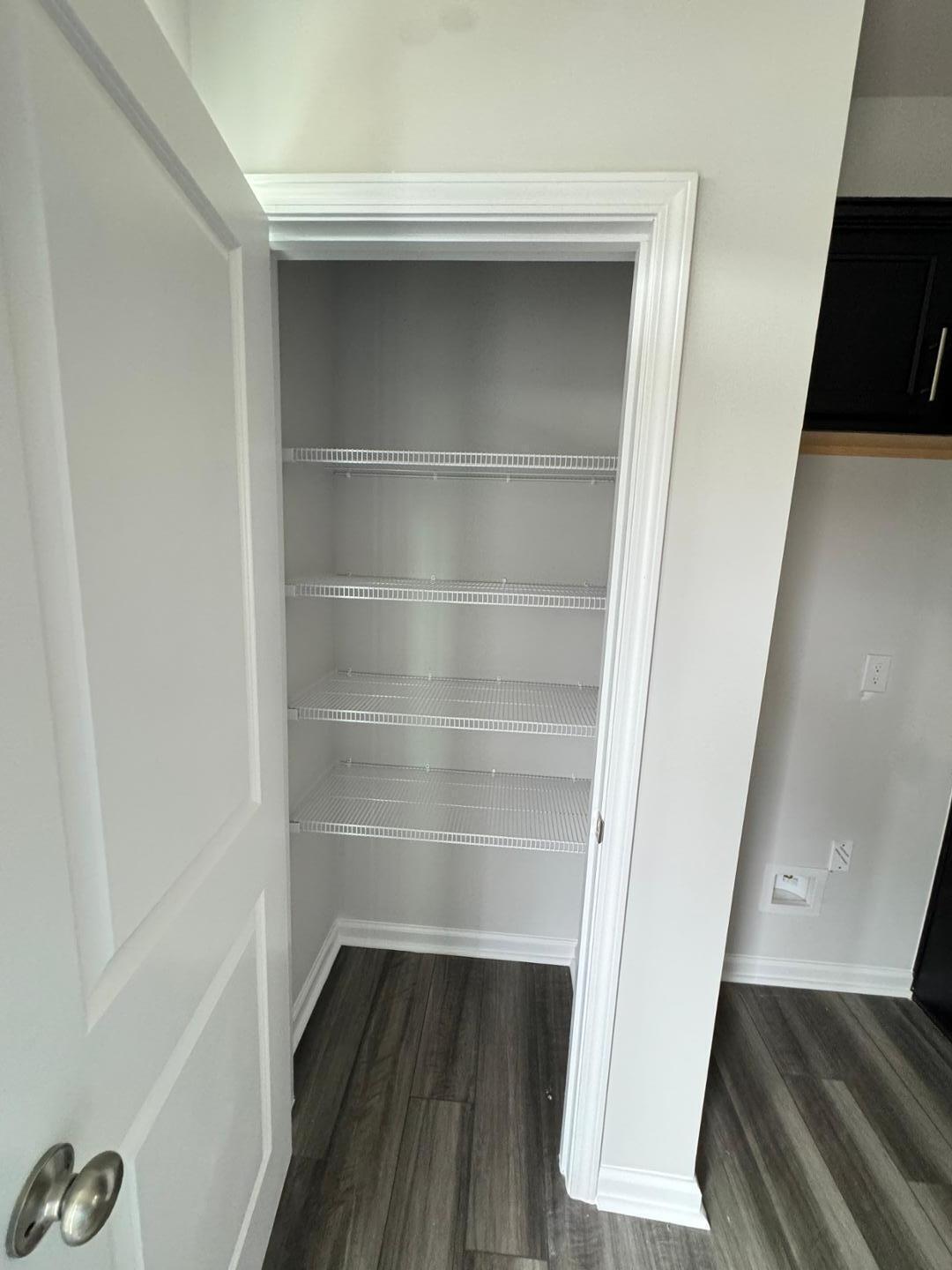 1038 Bristol Arch Drive Graham, NC 27253 - Photo 8 of 21 a view of walk in closet with empty racks