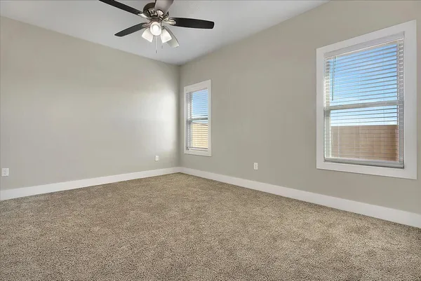 a bathroom with a granite countertop sink a mirror and a vanity