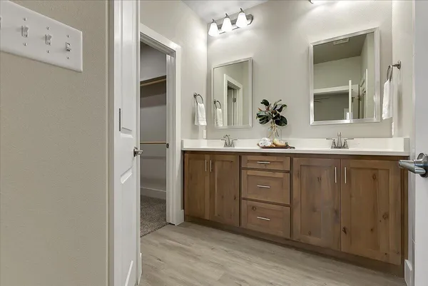 a bathroom with a shower and a sink