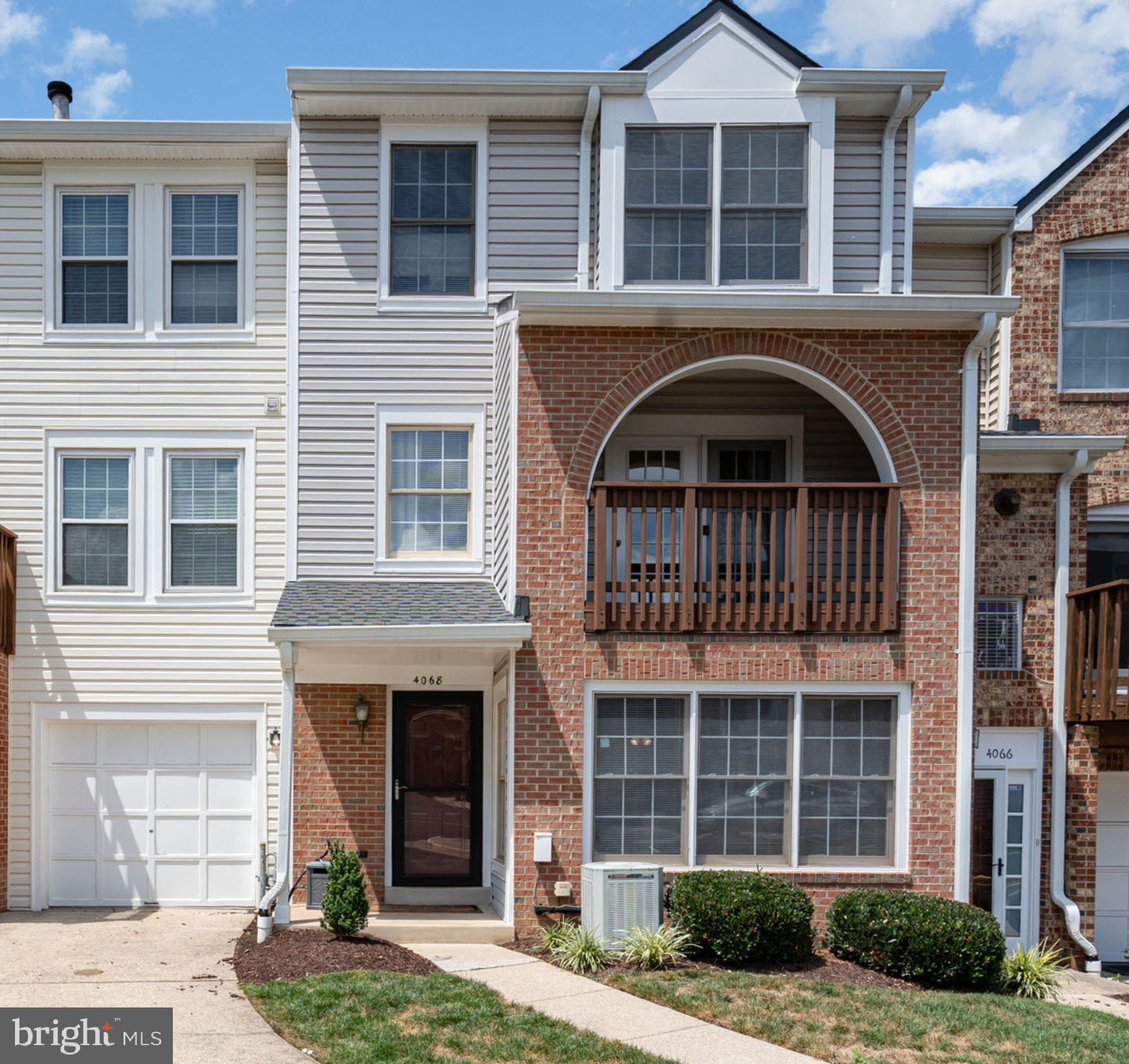 4068 Chetham Way Woodbridge, VA 22192 - Photo 1 of 27 a front view of a house with garden