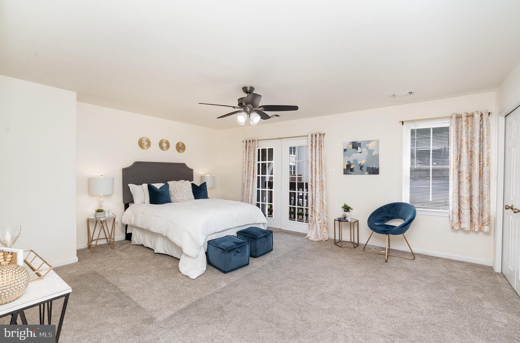 4068 Chetham Way Woodbridge, VA 22192 - Photo 16 of 27 a spacious bedroom with a bed and a cabinets