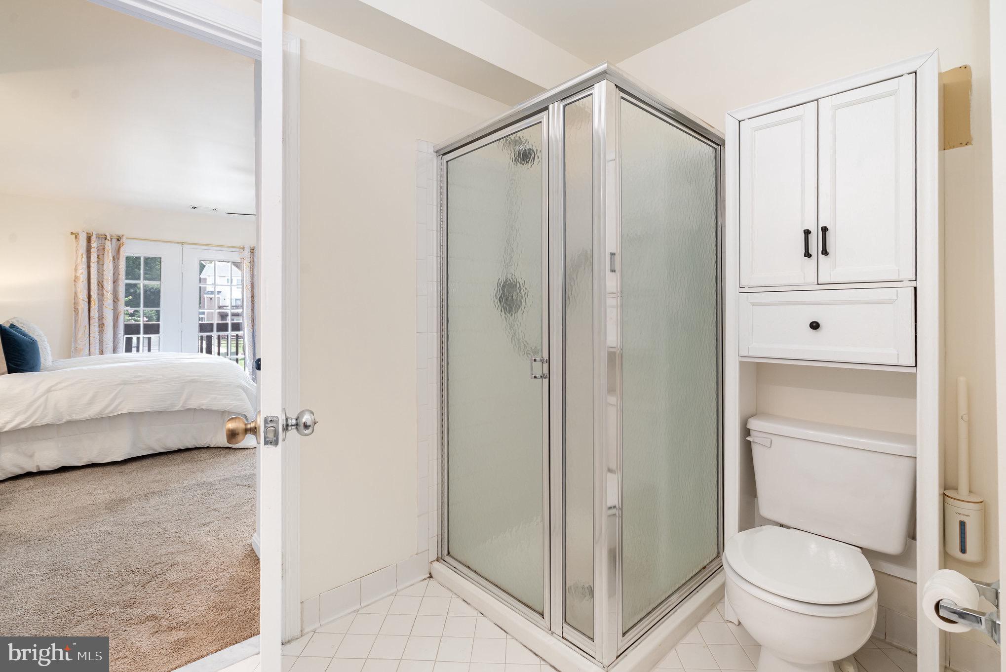 4068 Chetham Way Woodbridge, VA 22192 - Photo 20 of 27 a bathroom with a shower and a toilet