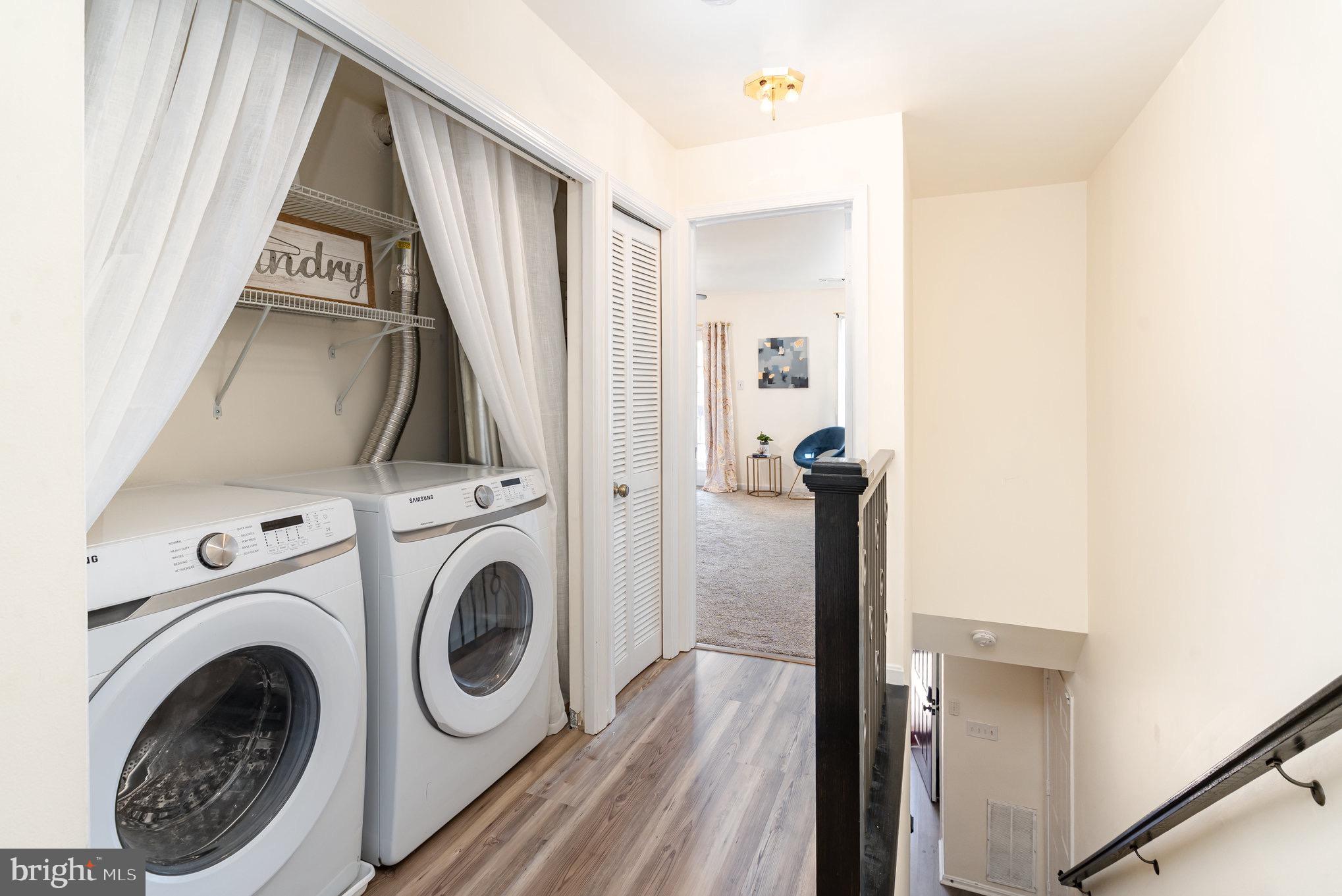 4068 Chetham Way Woodbridge, VA 22192 - Photo 23 of 27 a view of a hallway with washer and dryer