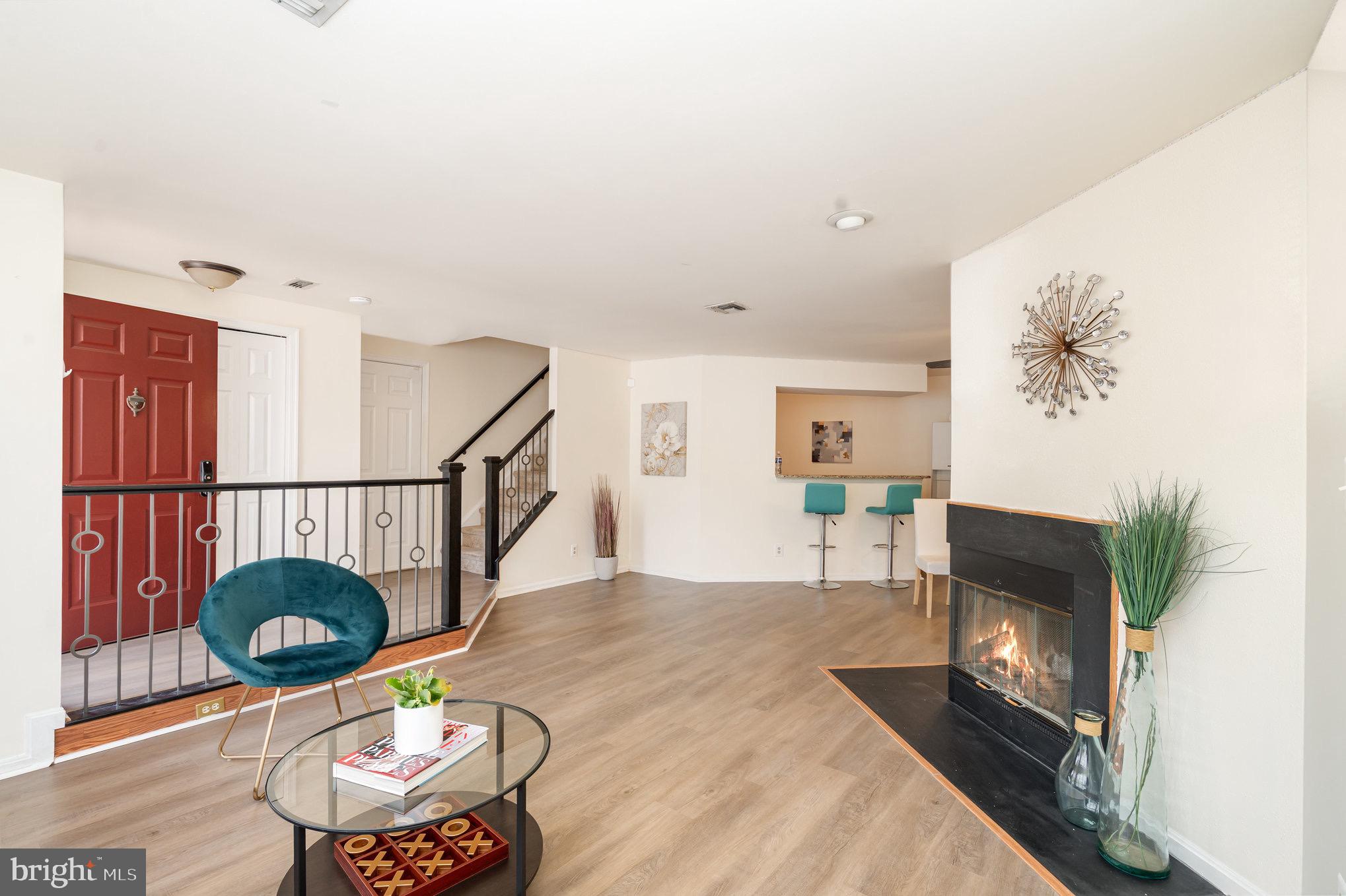 4068 Chetham Way Woodbridge, VA 22192 - Photo 6 of 27 a living room with furniture and a fireplace