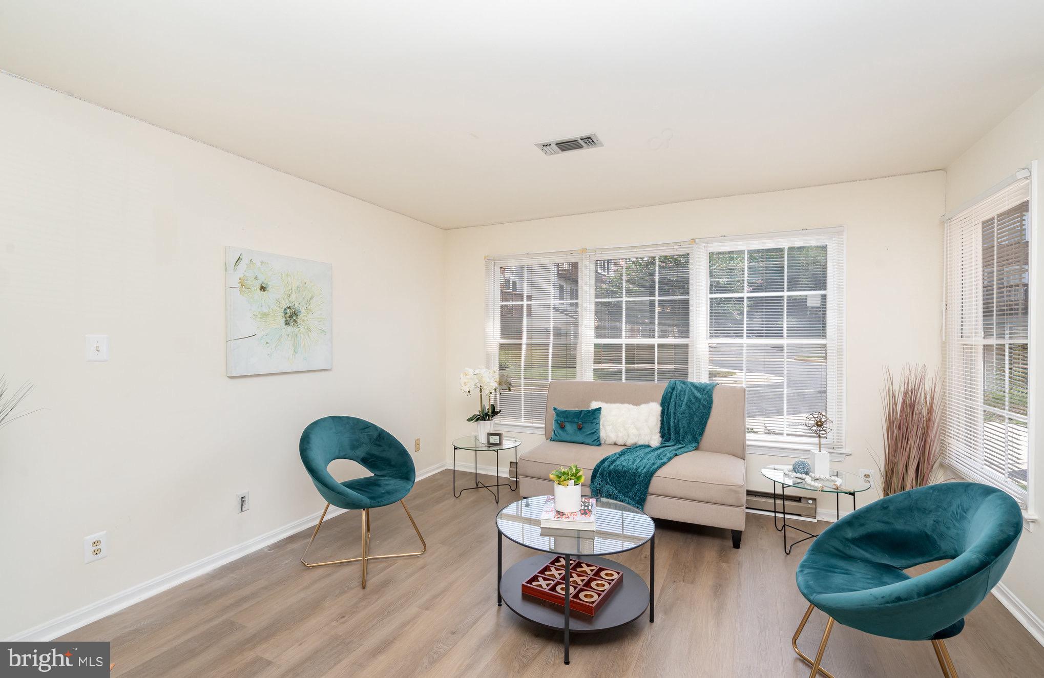 4068 Chetham Way Woodbridge, VA 22192 - Photo 7 of 27 a living room with furniture and a large window