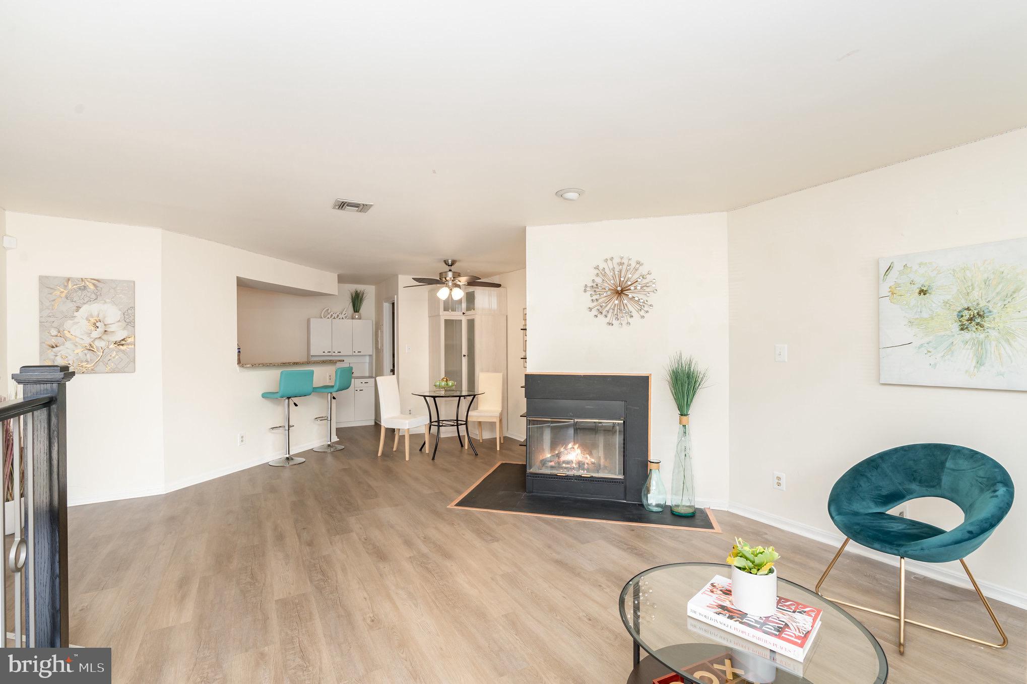4068 Chetham Way Woodbridge, VA 22192 - Photo 8 of 27 a living room with furniture and a fireplace