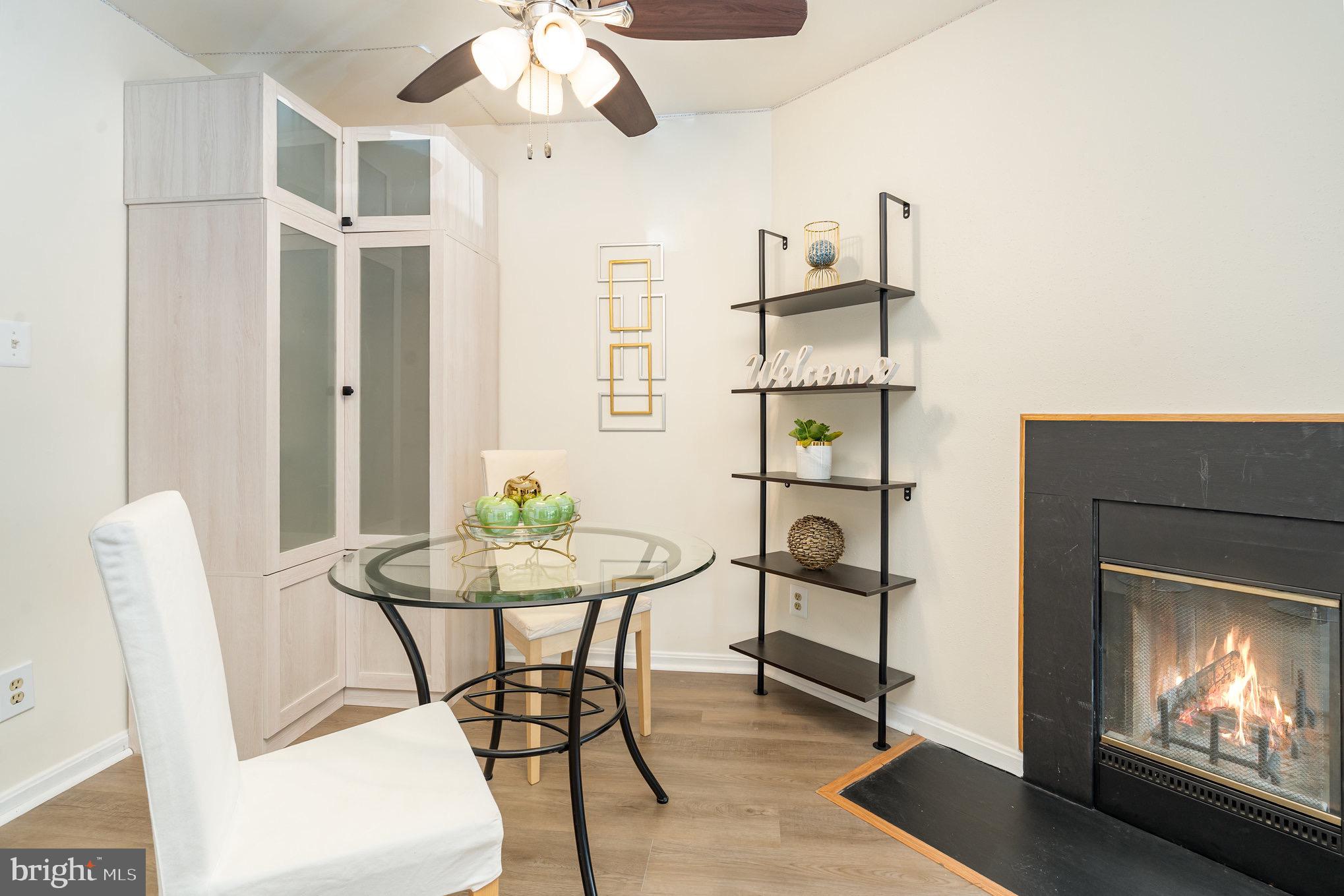 4068 Chetham Way Woodbridge, VA 22192 - Photo 10 of 27 a view of a livingroom with furniture and a fireplace