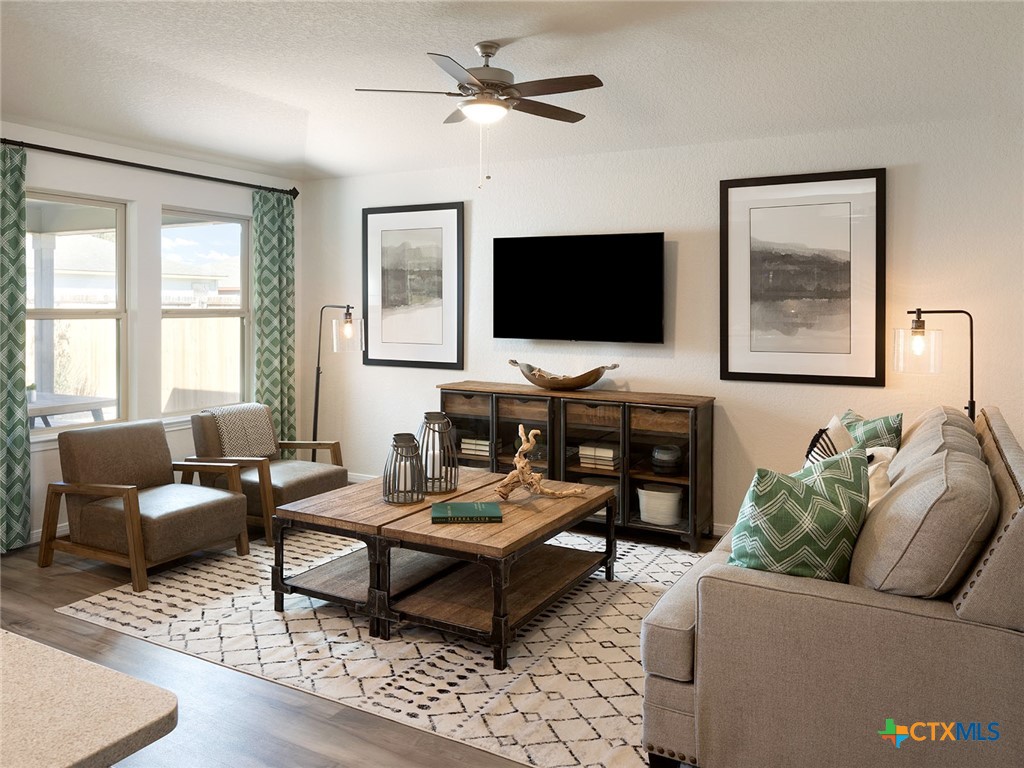 125 Dakota Ridge Cibolo, TX 78108 - Photo 5 of 13 a living room with furniture and a flat screen tv