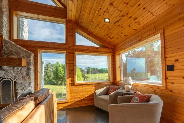 a balcony with furniture and a floor to ceiling window