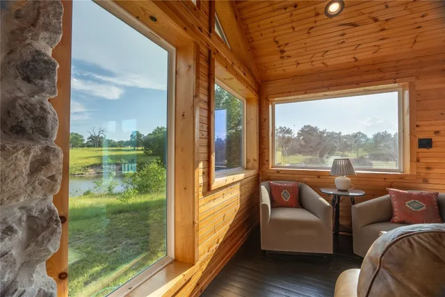 a view of a porch with wooden floor and stairs