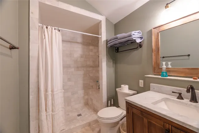 a view of a patio with a table chairs and a swimming pool