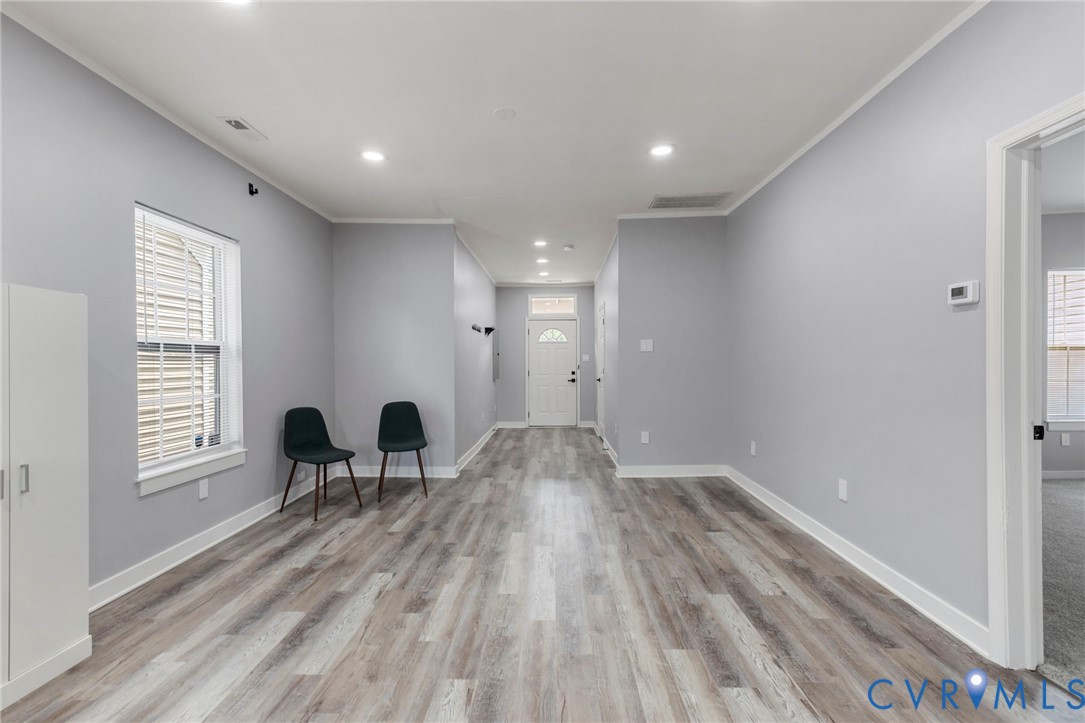 3061 Decatur Street Richmond, VA 23224 - Photo 20 of 23 a view of empty room with wooden floor and lounge chair