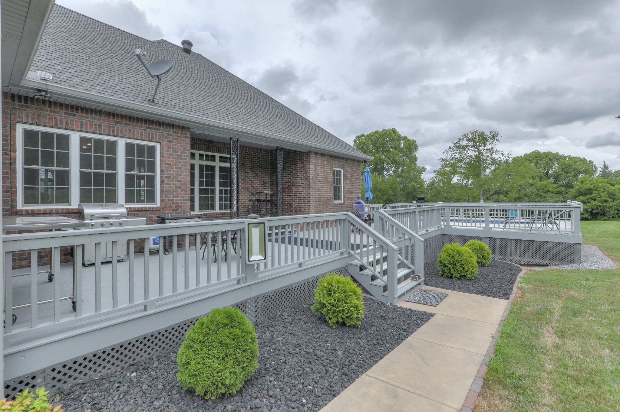 465 North Commerce Road Watertown, TN 37184 - Photo 3 of 47 a view of a deck with a chairs and table with wooden fence
