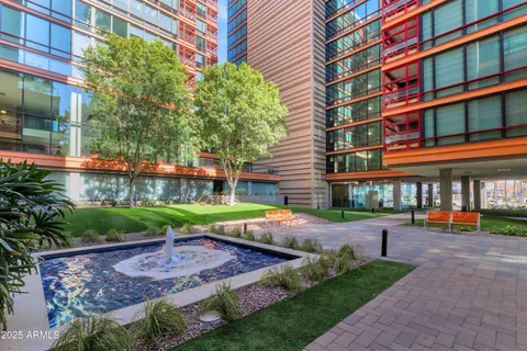 a view of a yard with plants and trees