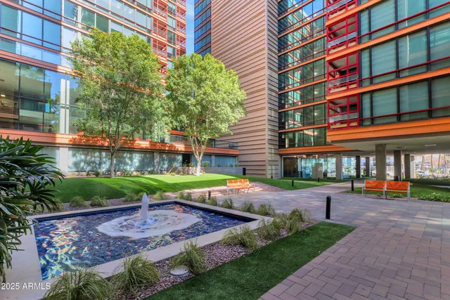 a view of a yard with plants and trees
