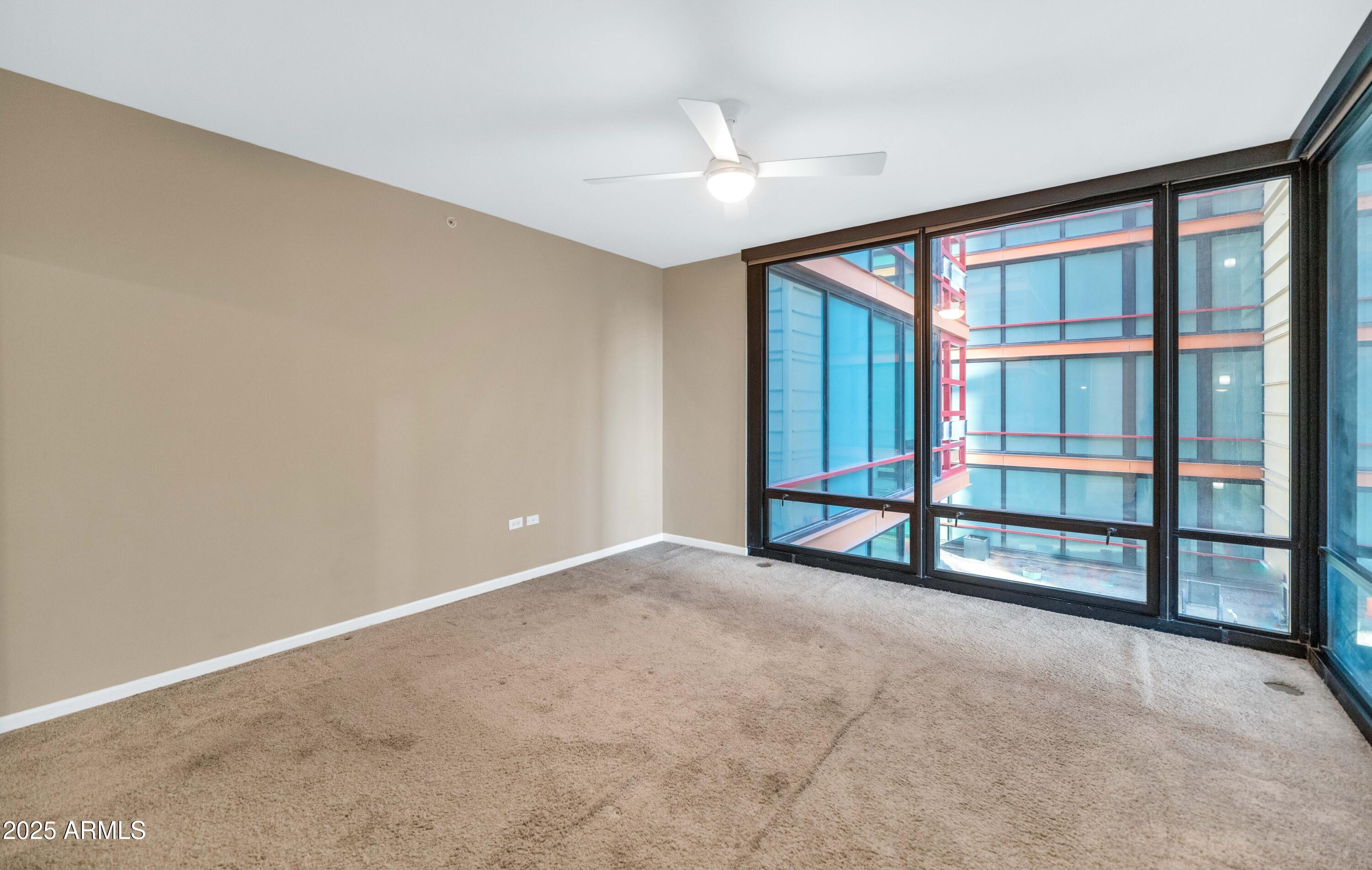4808 North 24th Street, Unit 522 Phoenix, AZ 85016 - Photo 10 of 27 a view of an empty room with a window