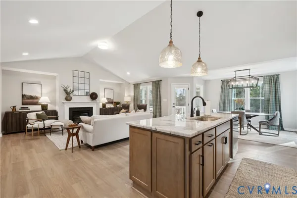 a open kitchen with stainless steel appliances granite countertop a stove and kitchen island