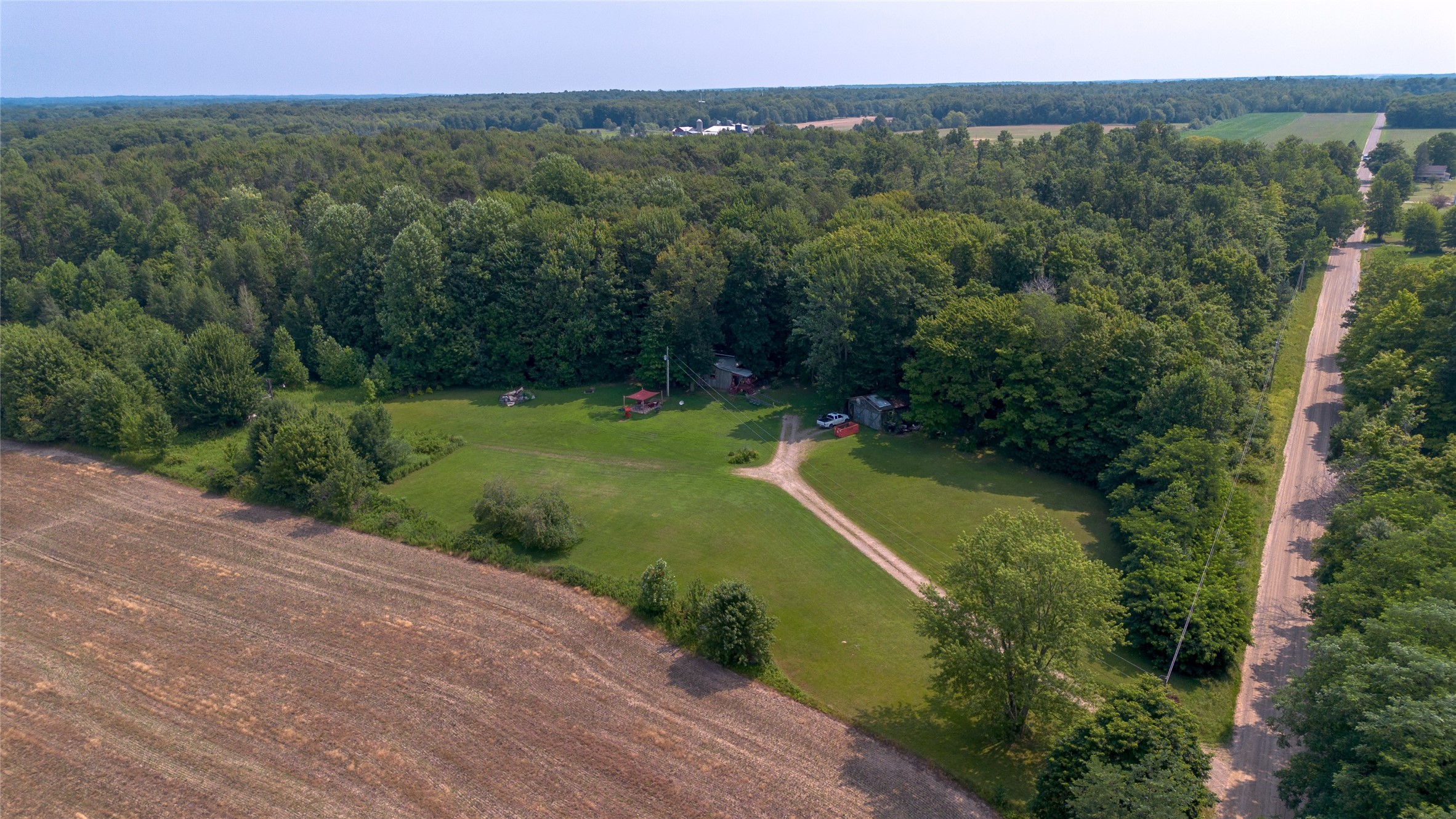 Richardson Road Cranesville, PA 16410 - Photo 10 of 15 an aerial view of green landscape with trees houses and mountain view