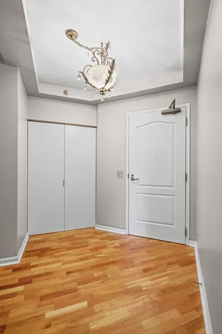 a view of a room with wooden floor