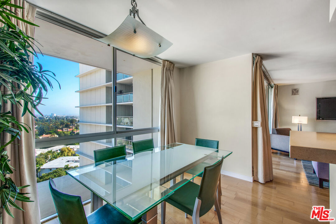 201 Ocean Avenue, Unit 1505B Santa Monica, CA 90402 - Photo 14 of 45 a view of a dining room with furniture window and wooden floor
