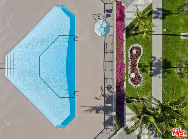 a view of a swimming pool with outdoor seating