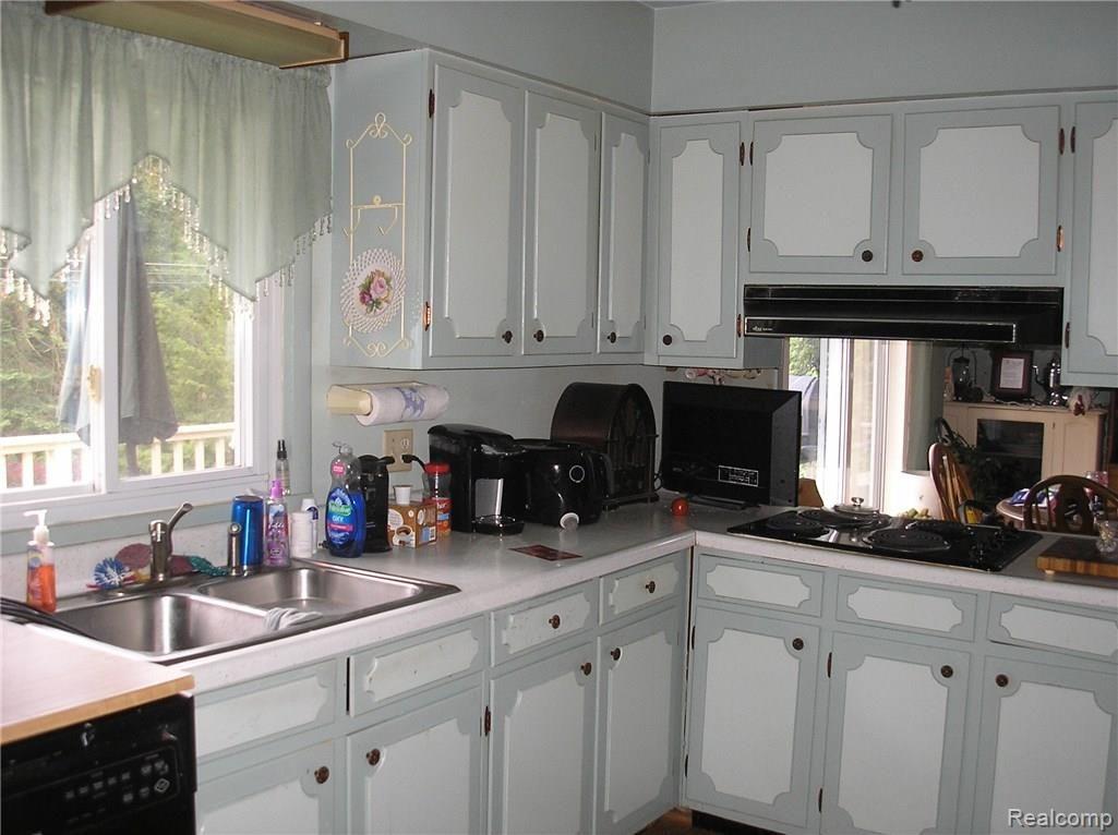 678 East Brown Road Mayville, MI 48744 - Photo 4 of 7 Great country kitchen with dining area and patio doors leading to 10 x 24 deck.