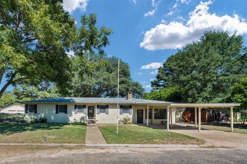616 Laurel Road, Unit A Athens, TX 75751 - Photo 1 of 24 a front view of a house with a garden