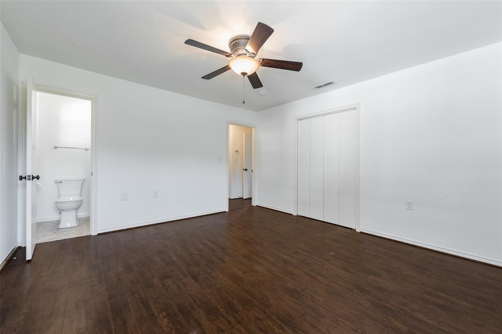 616 Laurel Road, Unit A Athens, TX 75751 - Photo 13 of 24 an empty room with wooden floor and a ceiling fan