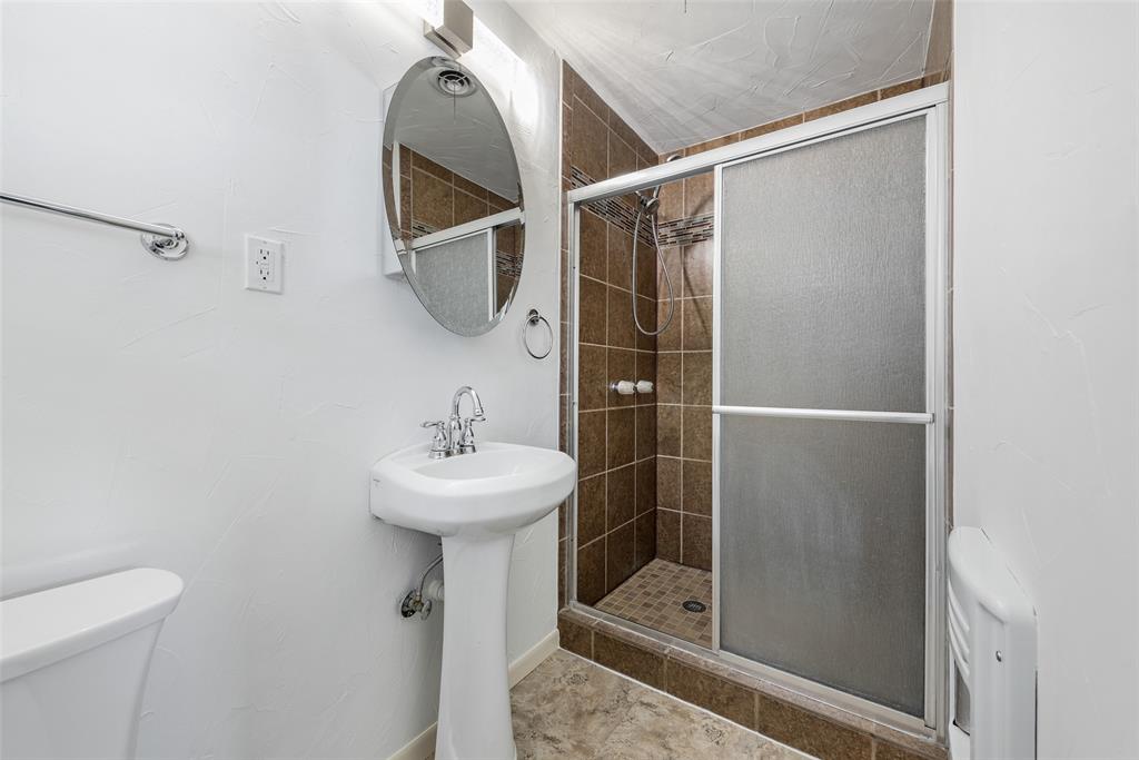 616 Laurel Road, Unit A Athens, TX 75751 - Photo 14 of 24 a bathroom with a sink toilet and mirror
