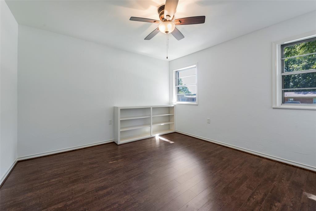 616 Laurel Road, Unit A Athens, TX 75751 - Photo 16 of 24 a view of an empty room with wooden floor and a window